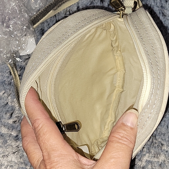 Canvas round crossbody purse. Has splashes of color. - Picture 10 of 10